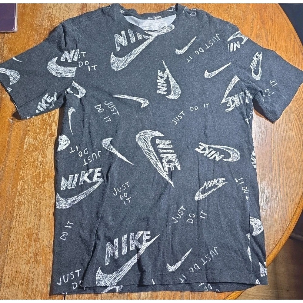 The Nike Tee Men's Large Black  Cotton T-shirt All Over‎ Logo Print Swoosh Logo